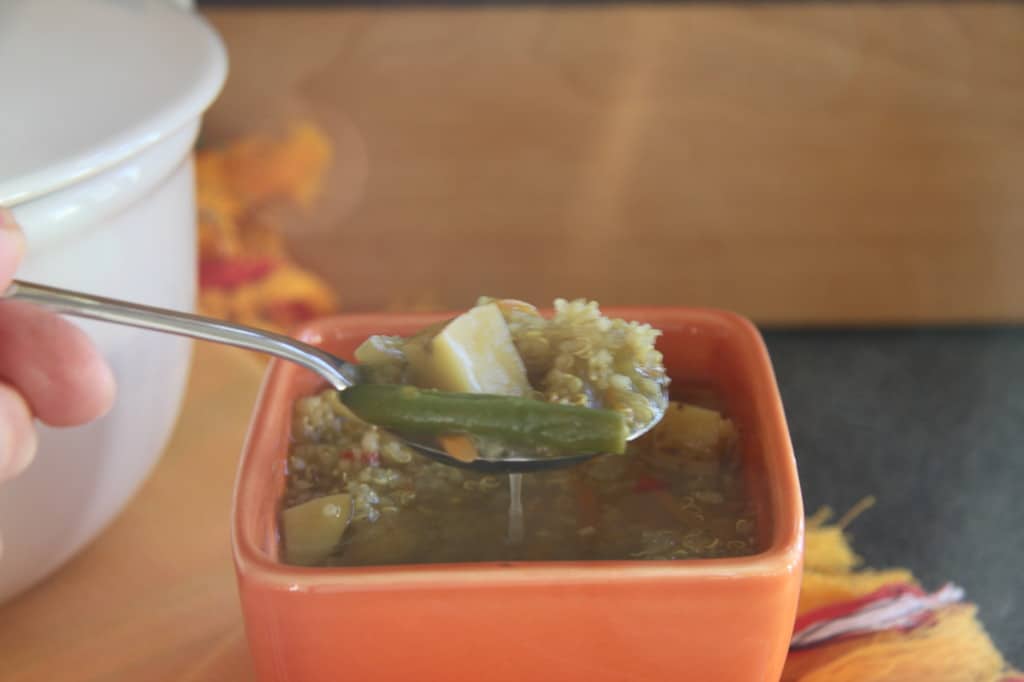 spoonful of Peruvian Quinoa Soup in a bowl 