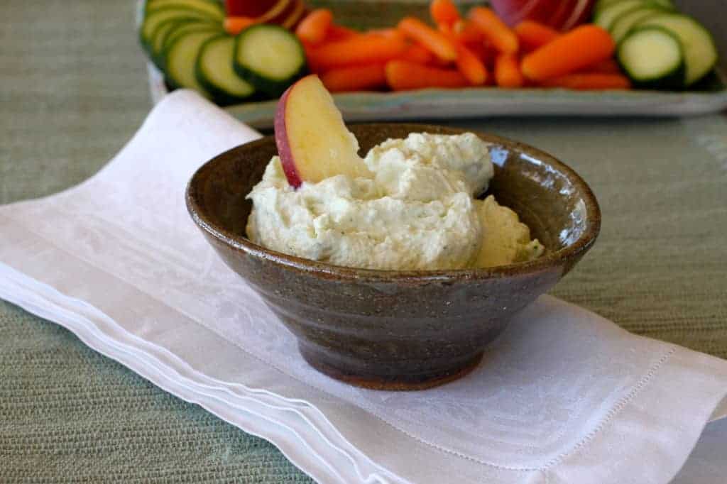 Blue Cheese Chive Dip in bowl with apple slice