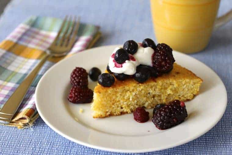 Cornbread Berries and Yogurt on a plate, with fork and napkin