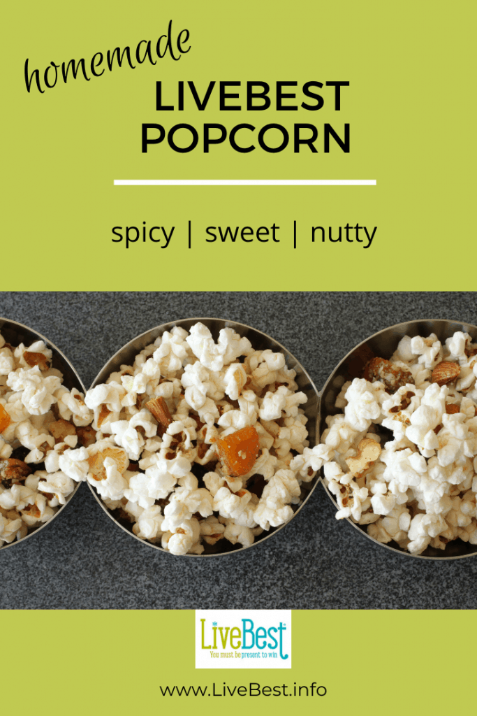 3 small bowls of popcorn with almonds, dried apricots, and coconut