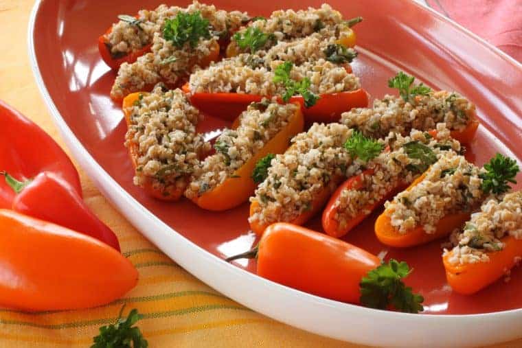 Tabouleh Stuffed Peppers | Fresh veggies, healthy fats, fiber and spices all add up to a dish with benefits - healthy ones! But people likely won't notice that. They'll just notice the refreshing flavors and how cute it looks! www.LiveBest.info
