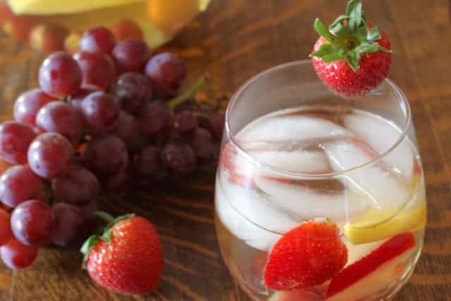 White Sangria in a glass with fruit garnish