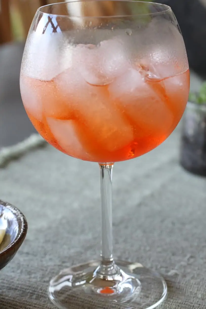 an ice and Aperol Spritz filled glass 