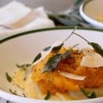 Bowl of packaged of refrigerated mushroom ravioli topped with cooked squash and a sage-infused brown butter