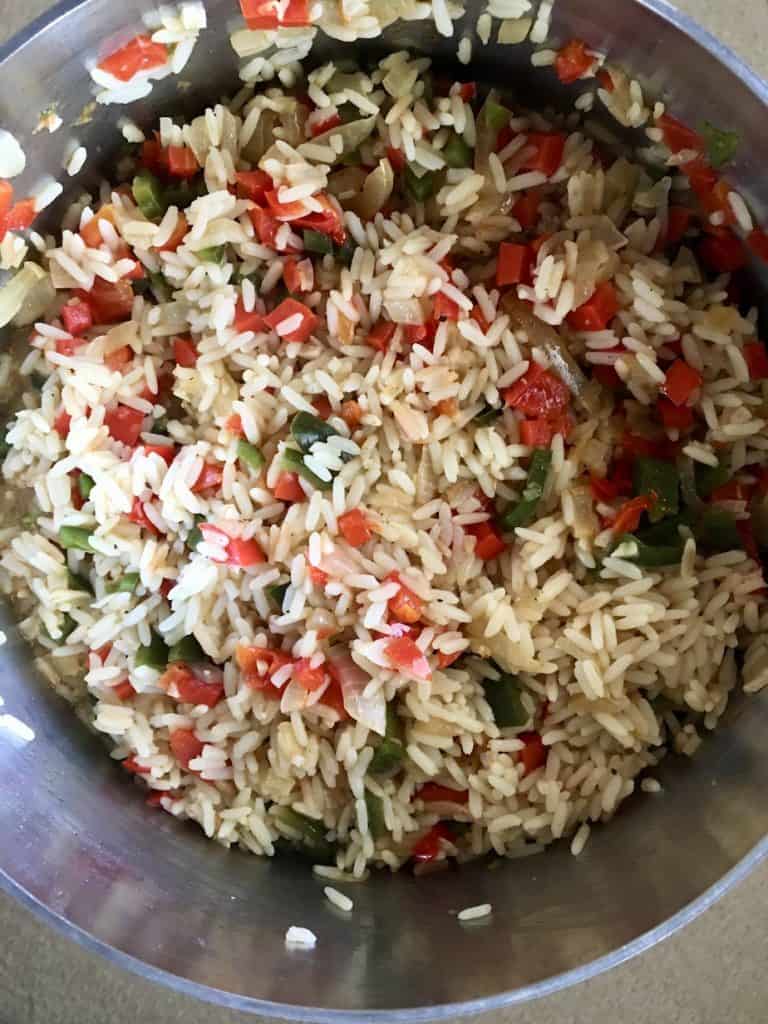 cooked rice. with peppers and onions for Gallo Pinto
