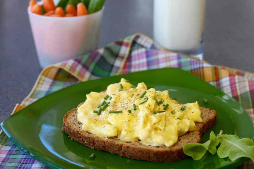 Curry Egg Salad sandwich  with milk and carrots