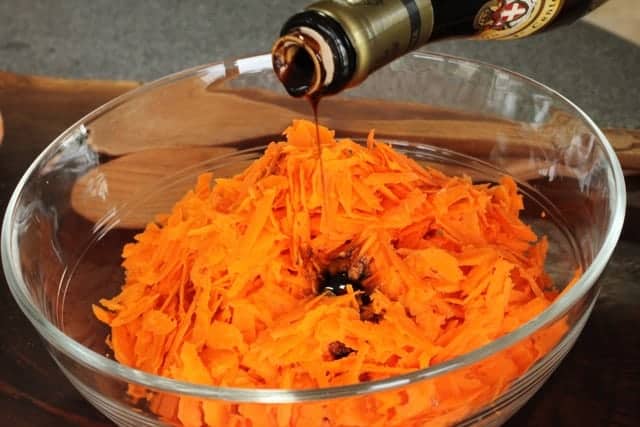 Balsamic Carrots with balsamic vinegar being dripped 