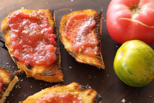 Grilled Tomato Bread with whole tomatoes on the side