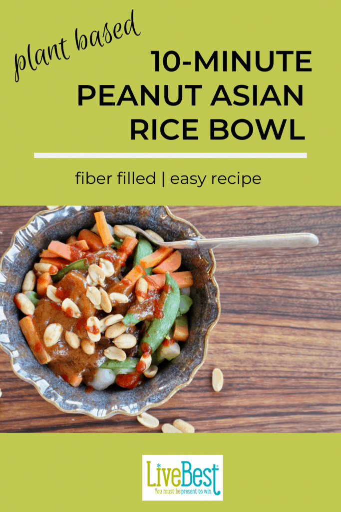 bowl of brown rice, vegetables. spicy peanut sauce and peanuts