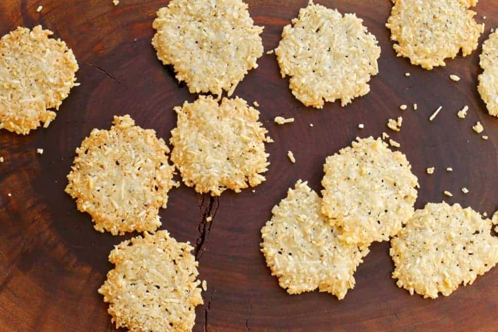 Parmesan Pepper Crisps scattered on a board