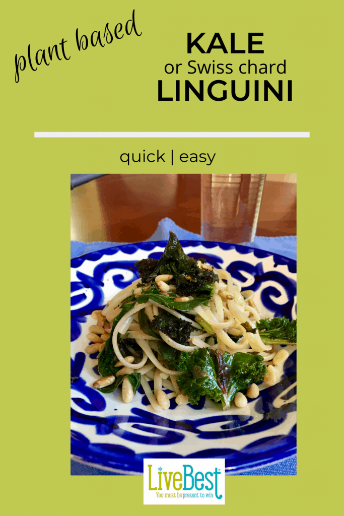 bowl with linguini, sautéed kale and pine nuts