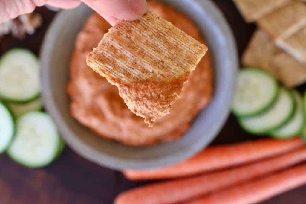 Roasted Red Pepper Dip on a cracker