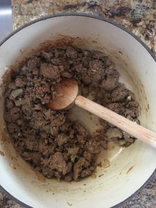 browned turkey sausage in Dutch oven