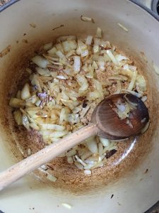 browned onions in Dutch oven