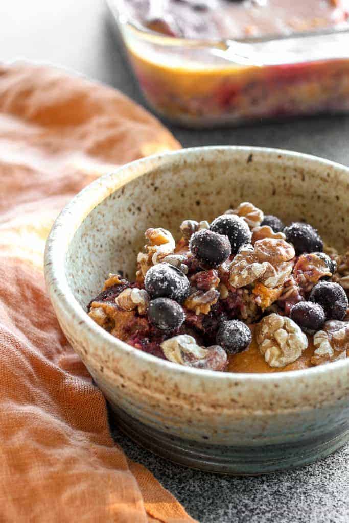 Pumpkin Spice Baked Oatmeal topped with blueberries and walnuts
