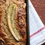 Banana Walnut Bread with a banana baked in the top