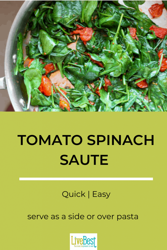 skillet with cooked spinach and tomatoes