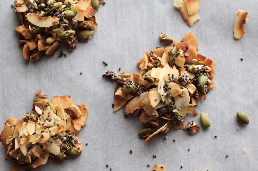 3 coconut seed clusters on parchment paper