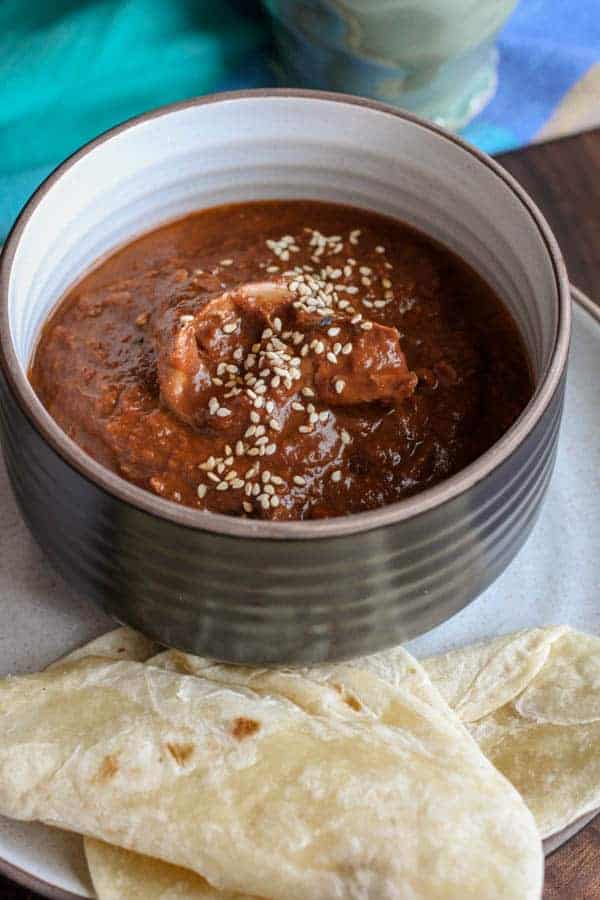 bowl of Chicken Mole with tortilla
