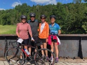 4 people on a bridge on Bike ride in Quebec