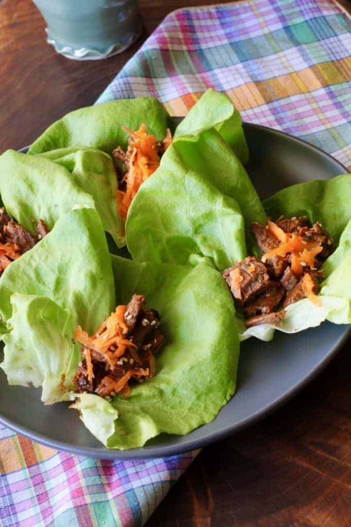 4 Korean Beef lettuce wraps on a plate