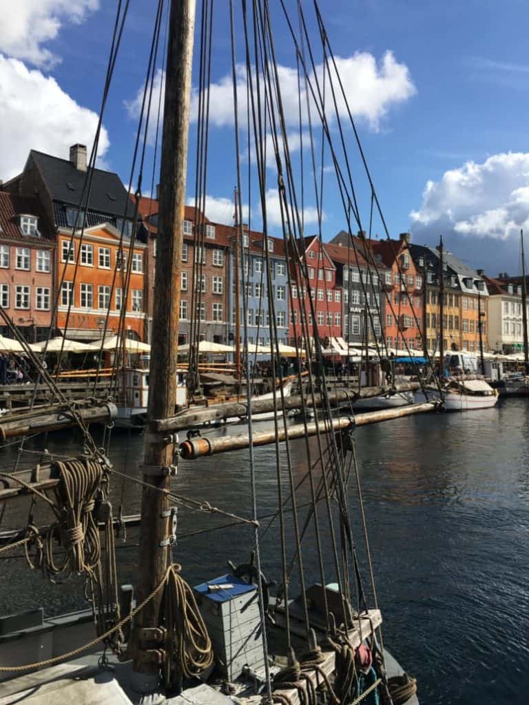 Nyhavn in Copenhagen boats and colorful houses