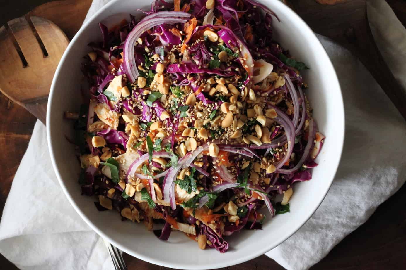bowl of asian chicken salad with red cabbage and carrots