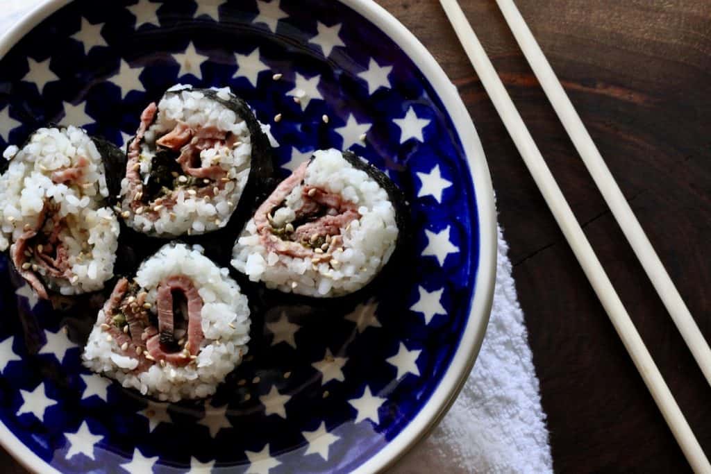 4 beef tartare sushi rolls on a plate