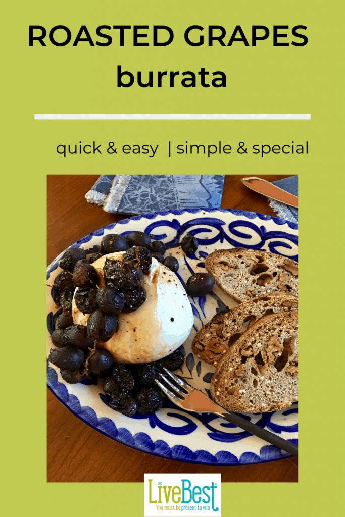 burrata cheese topped with roasted grapes on plate with toasted bread slices