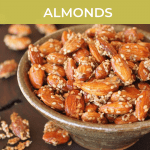 bowl of honey and sesame seed coated almonds