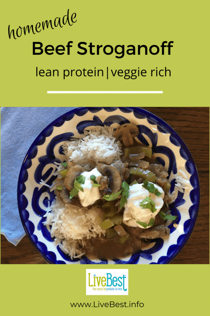 bowl of beef stroganoff with dollops of yogurt