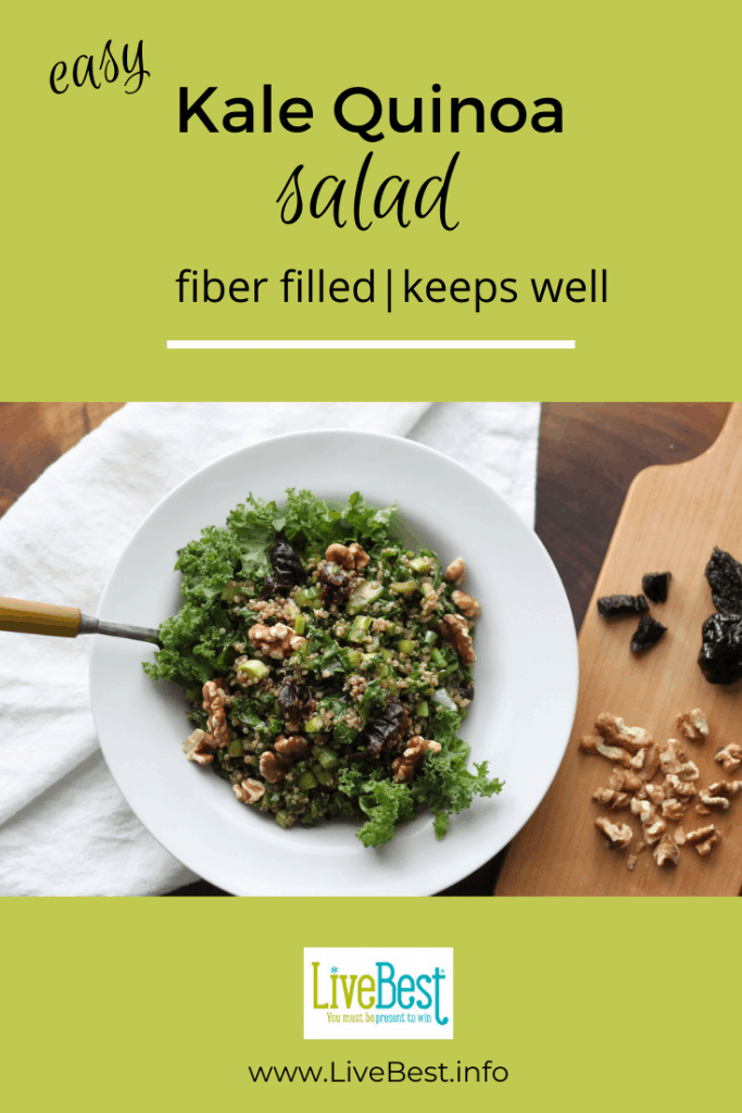 bowl of kale and quinoa salad with prunes and walnuts