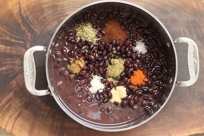 black beans with oregano, coriander, cumin, chia powder and other spices.