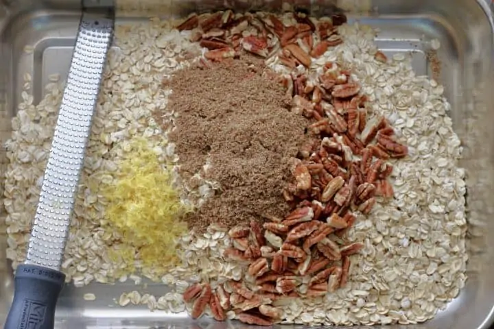 oats, ginger, pecans, lemon zest in baking sheet