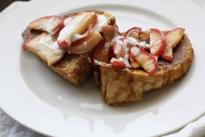 French toast topped with caramelized apples and yogurt drizzle
