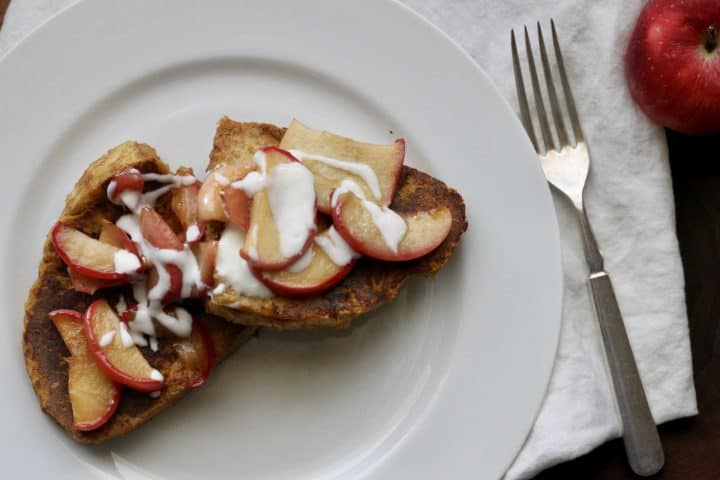 slices of pumpkin French toast with caramelized apples and yogurt drizzle