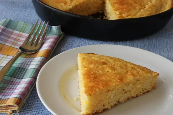wedge of cornbread on a plate