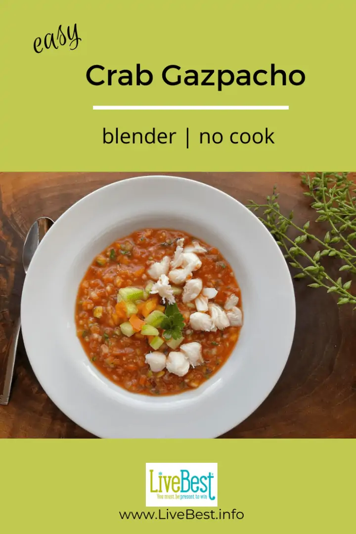 bowl of gazpacho with lamb crab, diced vegetables and parsley sprinkled over top