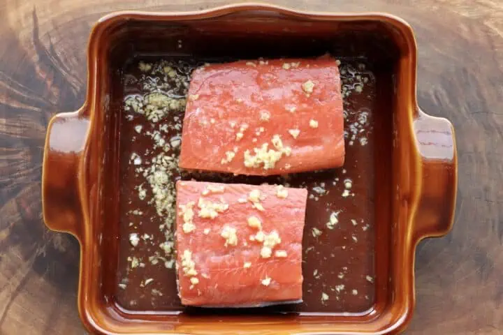 2 salmon filets wi baking pan with ginger garlic marinade